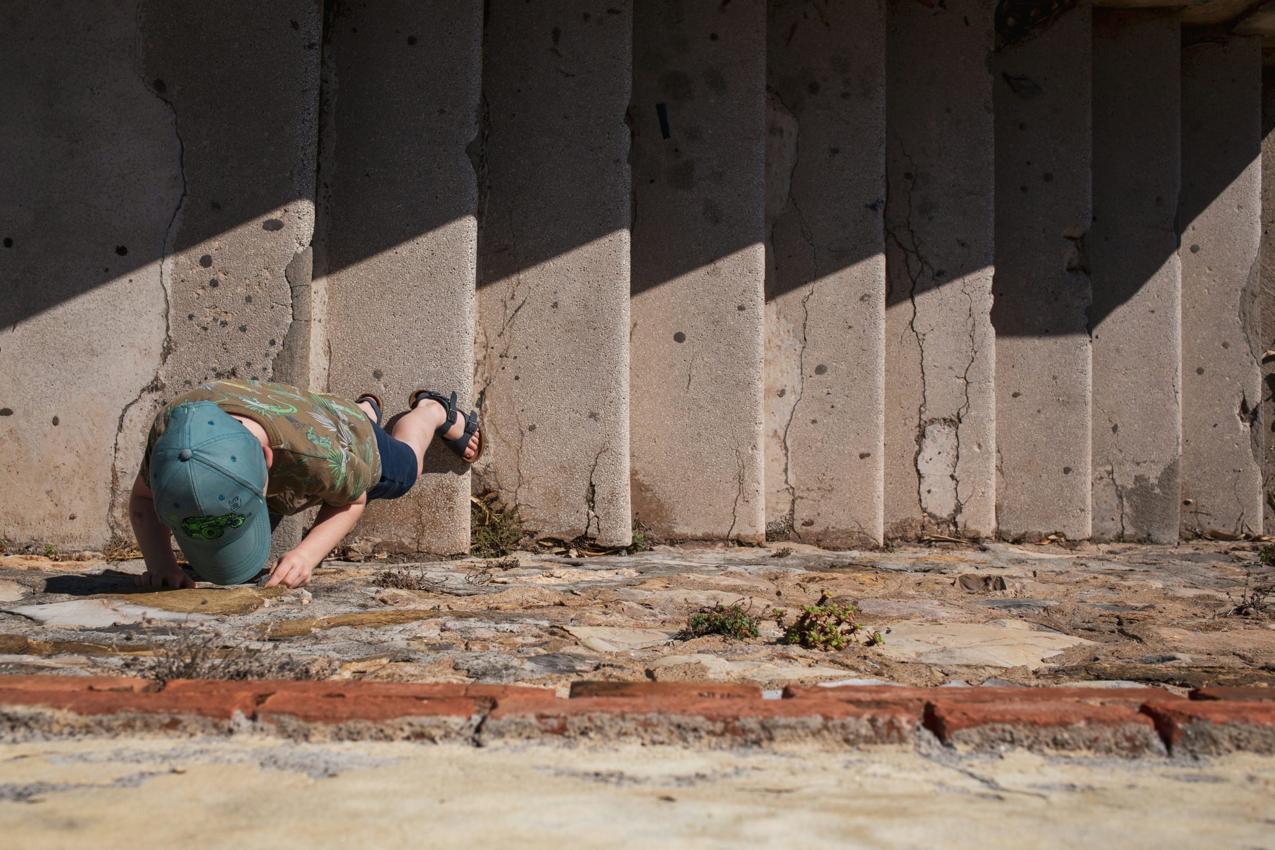 Foundation Inspection Boise Idaho contractor performing structural inspection of residential foundation using laser level